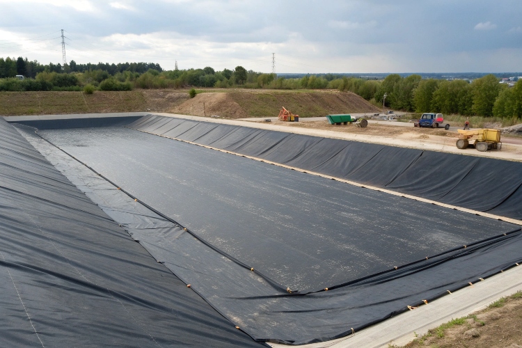 A conceptual image showing a geomembrane barrier separating clean water from polluted water