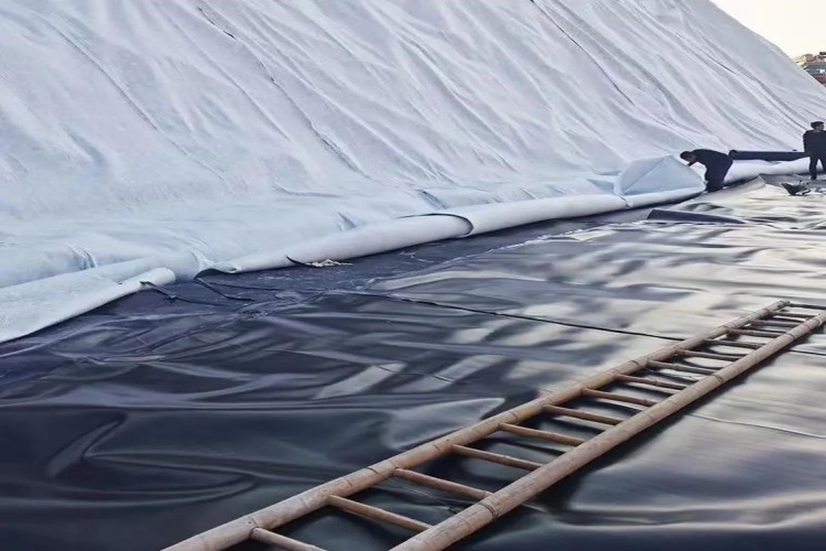 An illustration showing a composite geomembrane with a bonded textile layer resisting a sharp rock, compared to a single geomembrane being punctured