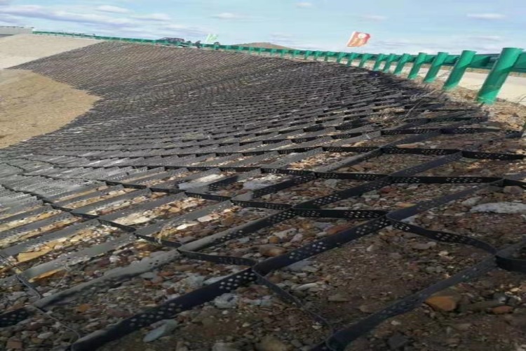 Diagram showing geocell under load and confining soil