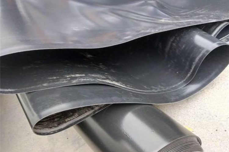 A field technician performing a pull-out test on a mechanical anchor to verify its strength