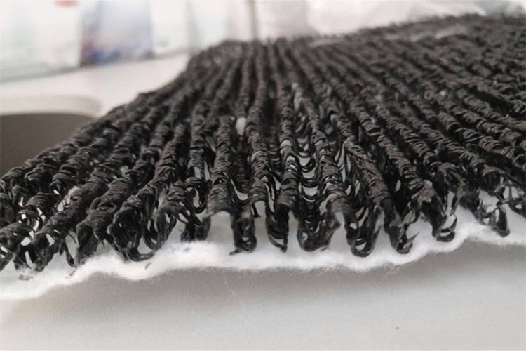 A close-up view of the three-dimensional grid structure of an HDPE geonet