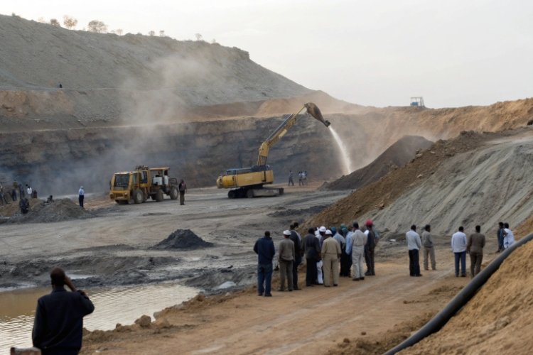 A mine control room with alarms flashing, indicating an emergency shutdown of the heap leach operation