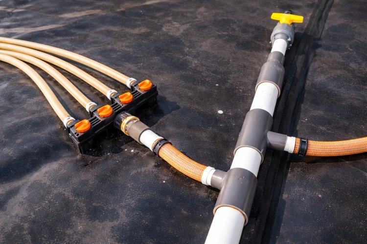 A technician performing an air pressure test on a dual-track fusion weld seam to ensure its integrity.