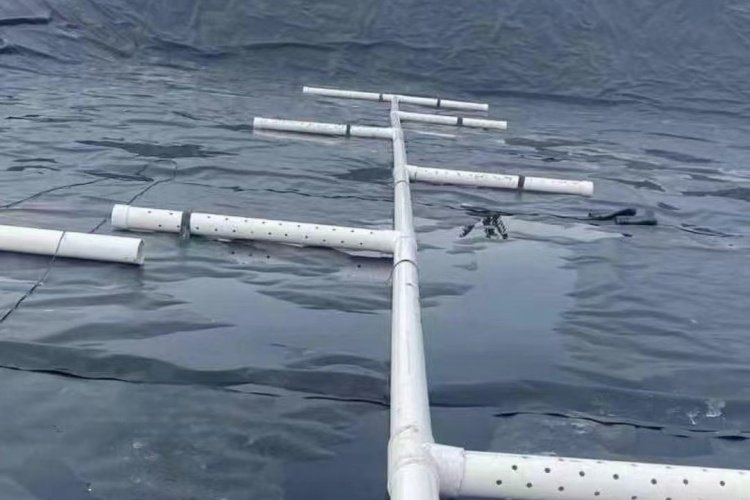 An image showing a damaged or torn geomembrane liner in a lagoon, highlighting the consequences of failure.