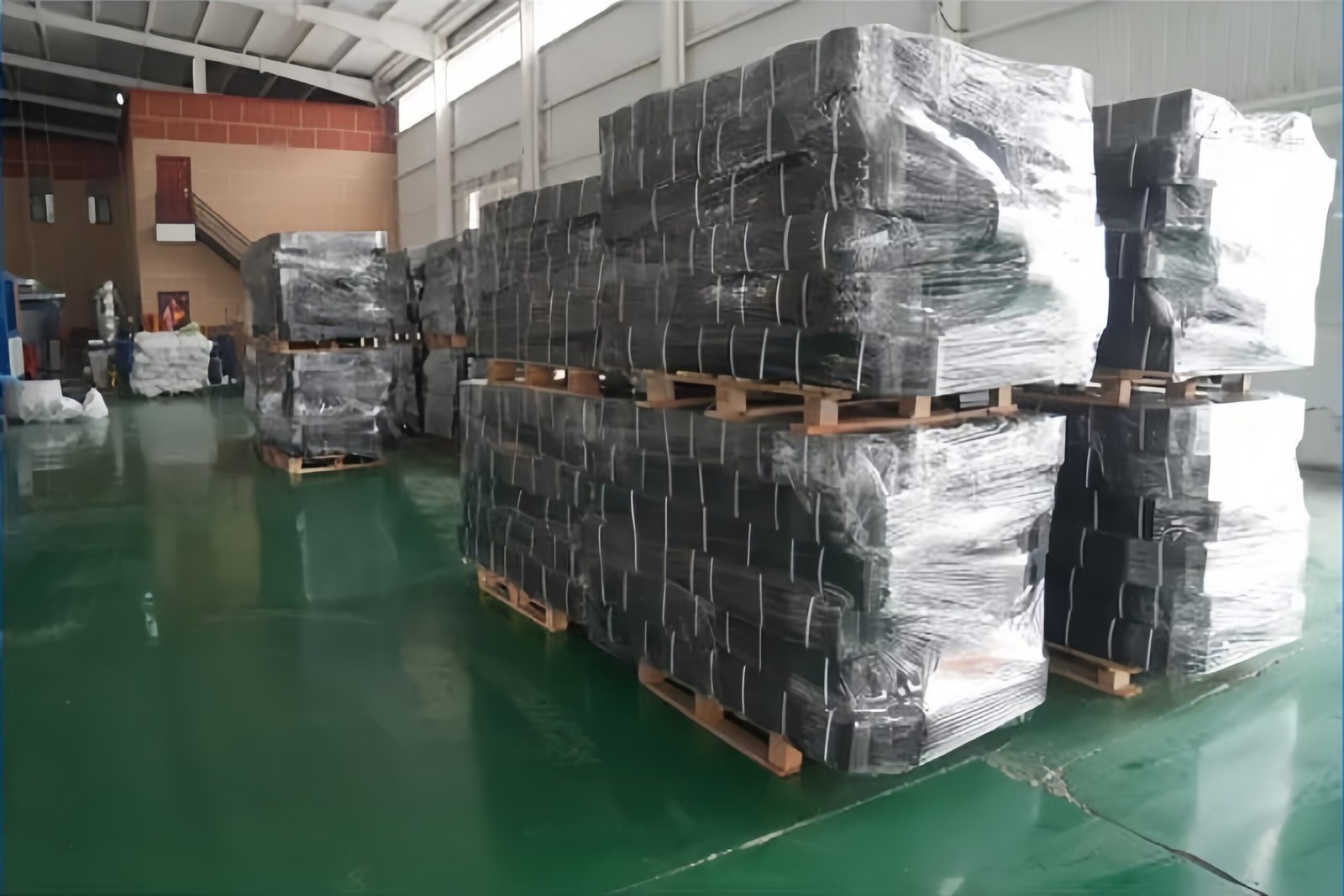 Forklift loading geocell pallets into container