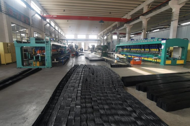 Close up of geocell bundles with strapping and corner guards