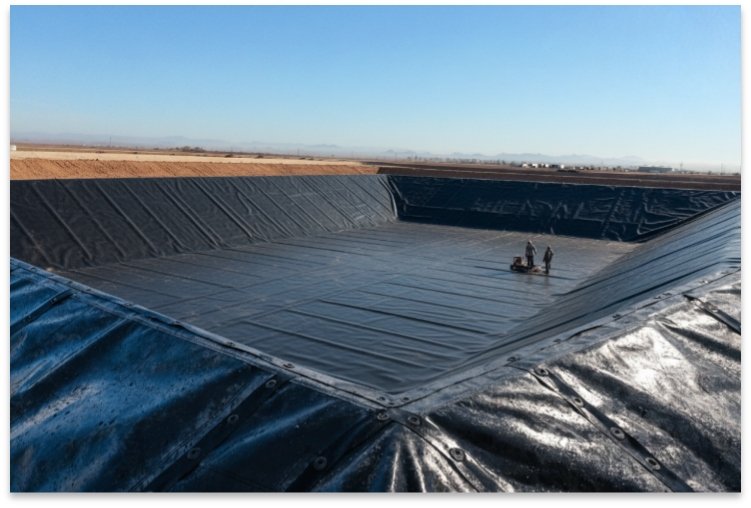 Completed secondary containment area with black HDPE liner